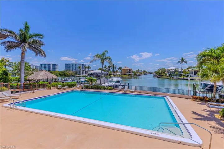 Community pool with a water view