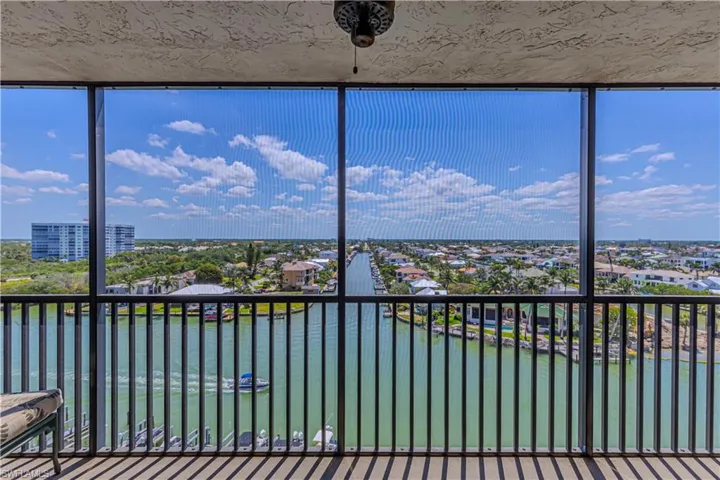 Unfurnished sunroom featuring a water view