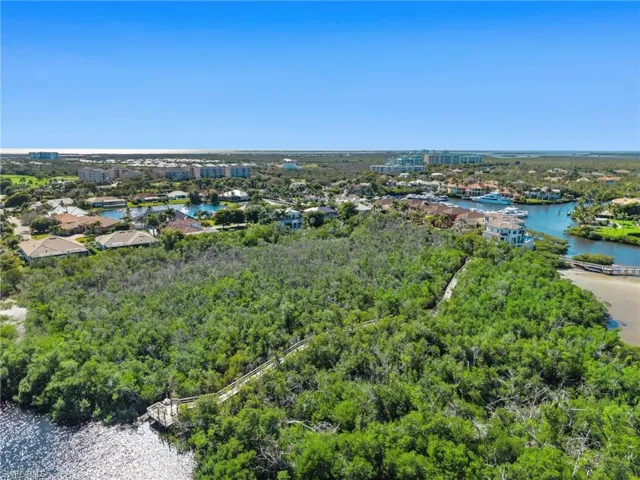 Aerial perspective of suburban area with a large body of water