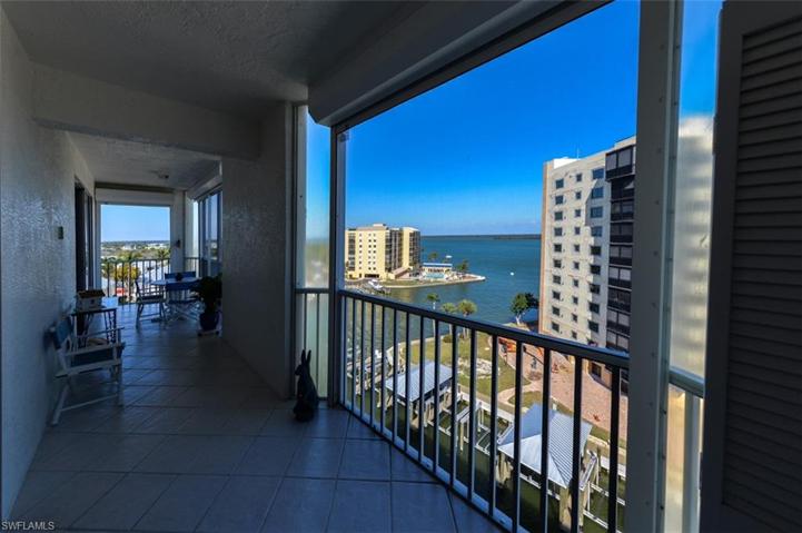 SPACIOUS LANAI WITH ESTERO BAY AND INTERSECTING CANAL VIEWS.  ELECTRIC SHUTTERS.