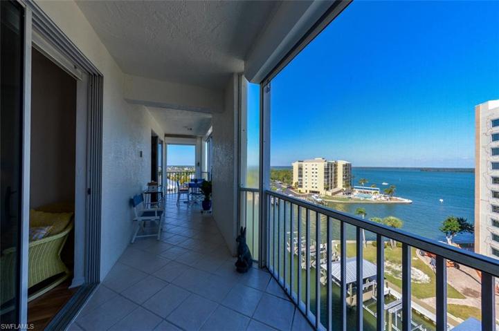 SPACIOUS TILED AND SCREENED LANAI.  ENTRANCE TO OWNER'S SUITE SHOWN AT LEFT.  ELECTRIC SHUTTERS.