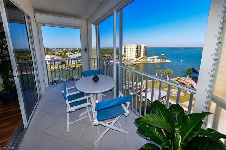 ESTERO BAY AND INTERSECTING CANAL VIEWS FROM THIS TOP FLOOR UNIT.  ELECTRIC SHUTTERS ON LANAI.