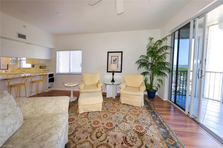 LIVING AREA W/MANUFACTURED FLOORING.  BREAKFAST BAR.