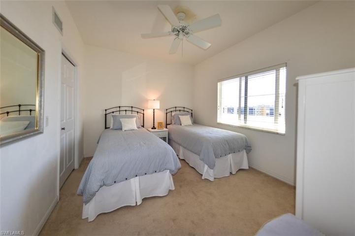 GUEST BEDROOM.  ENTRANCE TO WALK-IN CLOSET IS SHOWN MIDDLE LEFT.
