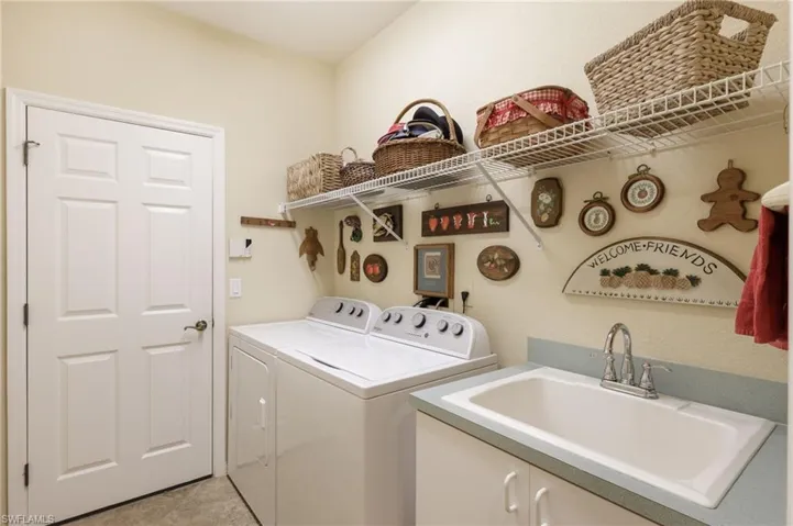 Laundry room with wash tub