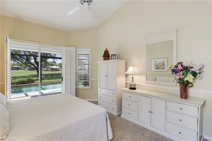 Primary bedroom with sliders to pool/lanai