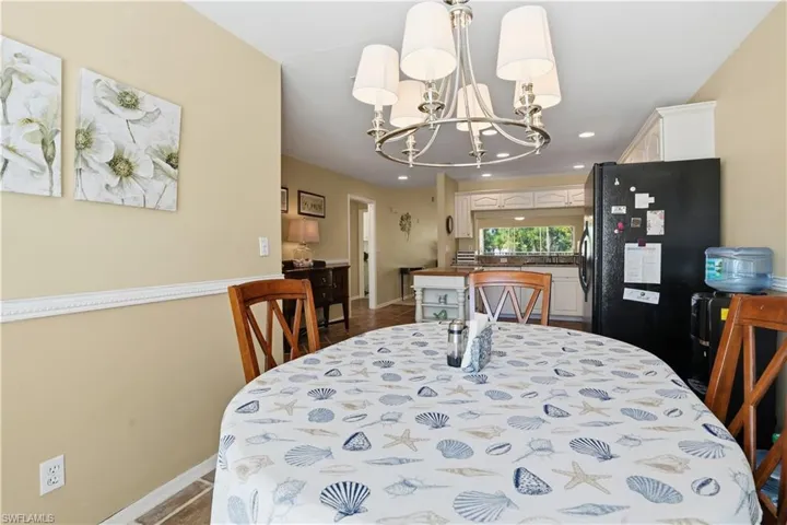 Dining area featuring a chandelier, recessed lighting, and light tile patterned floors