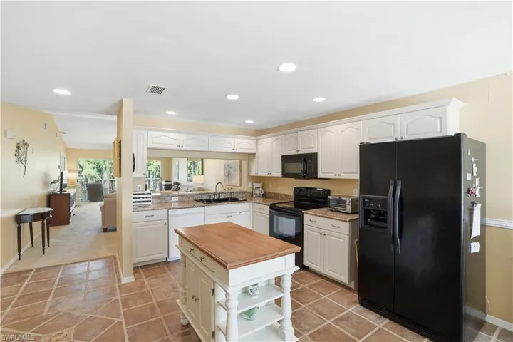 Dining space with a chandelier and light tile patterned floors