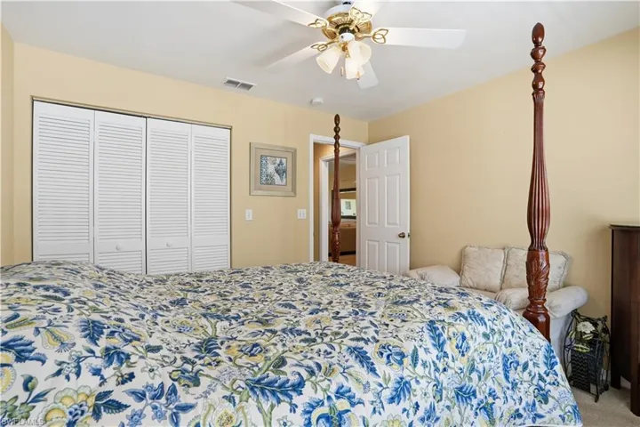 Bathroom with vanity, a stall shower, a closet, and light tile patterned flooring
