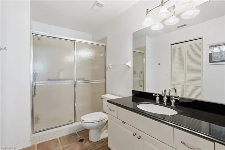 Full bath featuring vanity and shower / tub combo with curtain