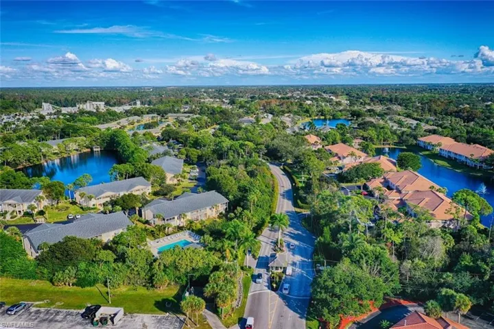 Aerial perspective of suburban area with a nearby body of water