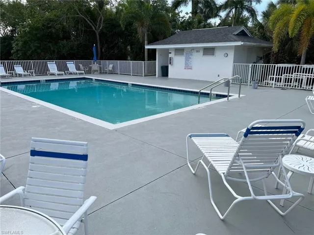 Community pool with a patio
