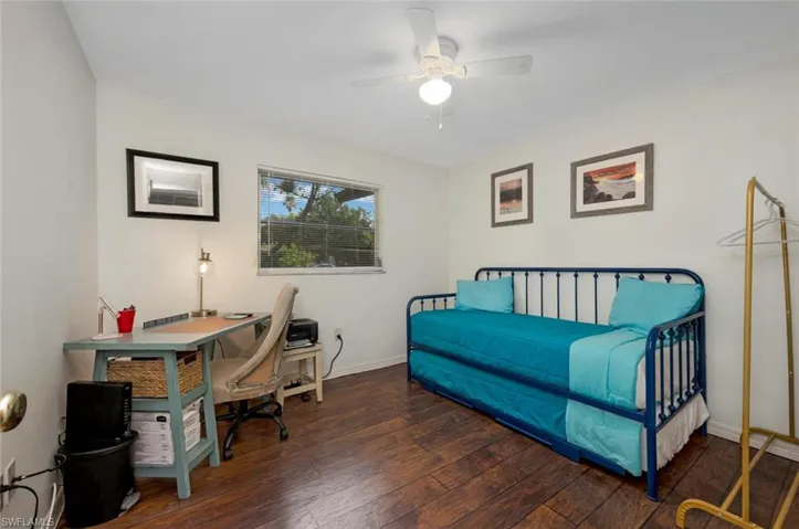 Bedroom 3 featuring dark hardwood / wood-style floors and ceiling fan