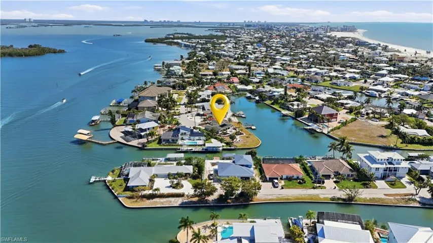 Aerial perspective of suburban area with a large body of water - Virtually Edited Image