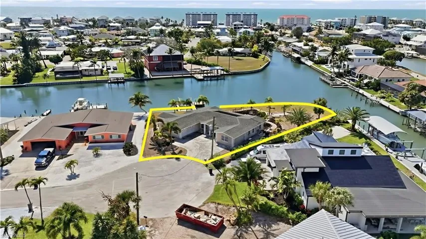Aerial perspective of suburban area with a large body of water - Virtually Edited Image