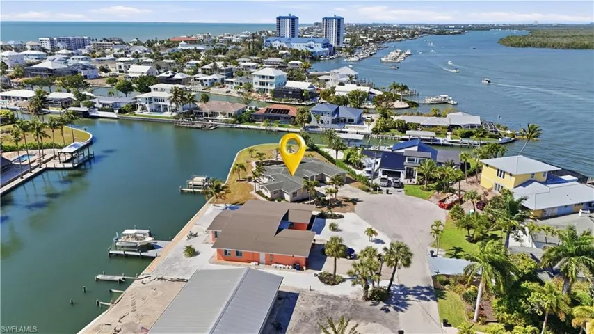 Aerial perspective of suburban area featuring a large body of water - Virtually Edited Image