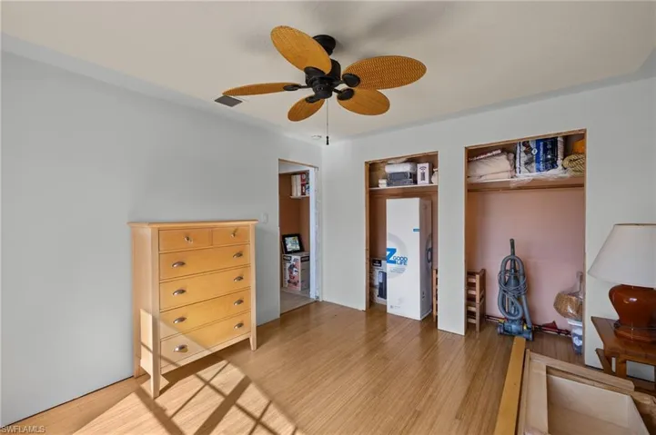 Bedroom featuring ceiling fan and wood-type flooring