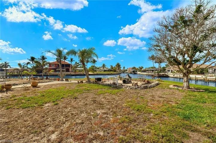 View of yard with a water view virtually enhanced images