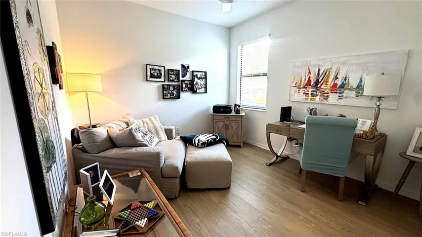 Office area with wood finished floors and baseboards