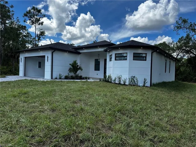 View of front of property with a front lawn