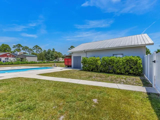View of yard with a fenced in pool