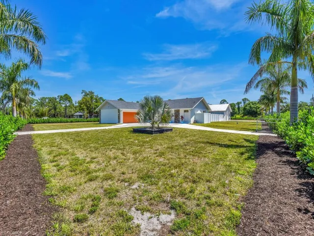 View of yard with a garage