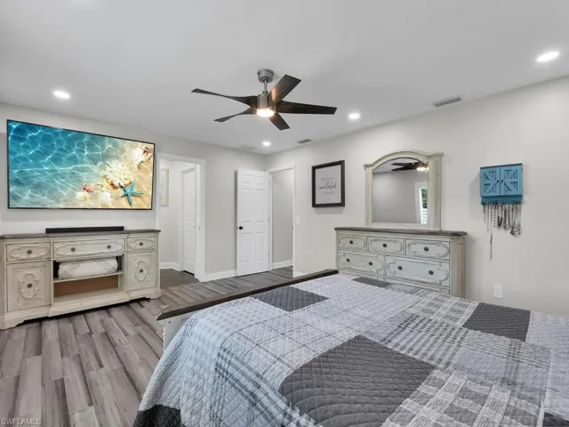 Bedroom featuring ceiling fan and light wood-type flooring