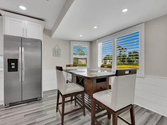 Dining area with plenty of natural light and light wood-type flooring