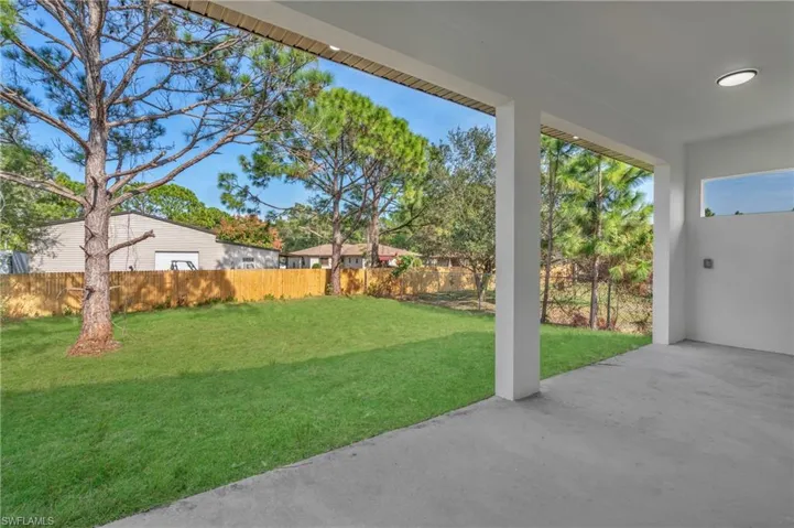 Fenced backyard featuring a patio
