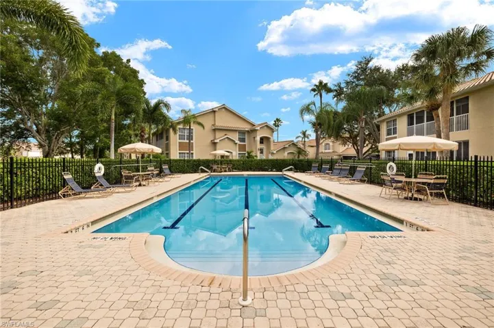 Community pool featuring a patio
