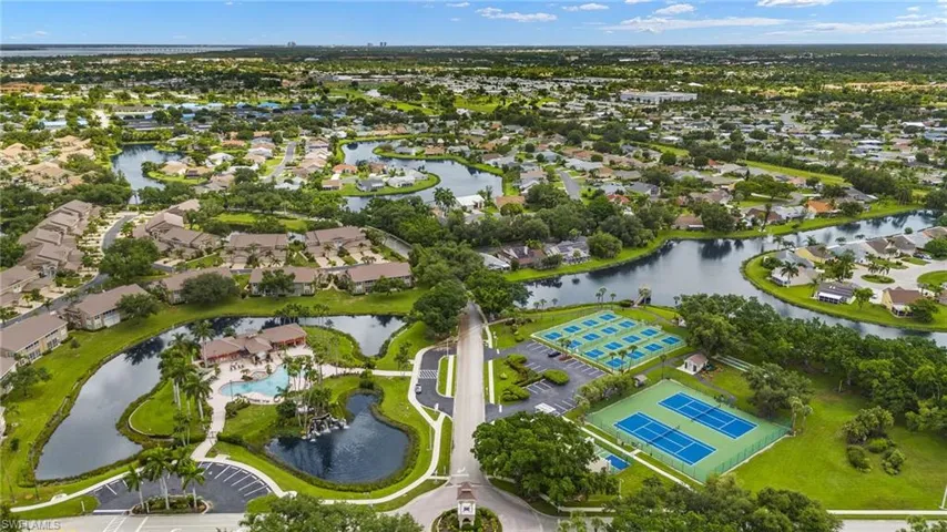 Aerial perspective of suburban area with a large body of water