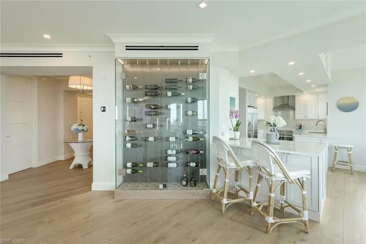 Breakfast bar and wine display case.