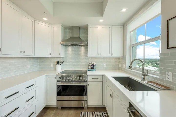 Lots of drawer storage in kitchen.  Light bright window above large sink.