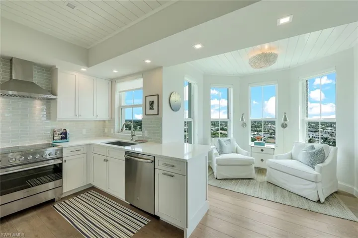 Kitchen open to conversation area.