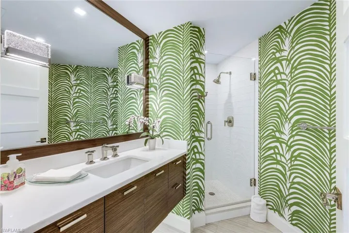 Third full bath with floating vanity and walk in shower.