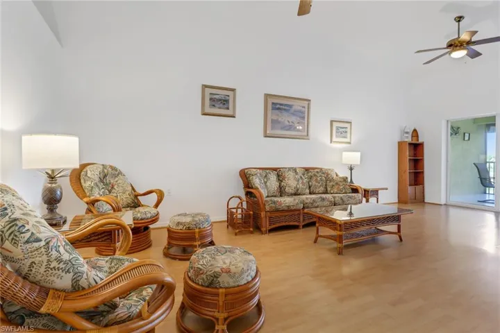 Living room featuring ceiling fan and light hardwood / wood-style floors