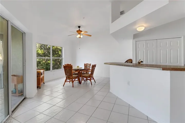 Tiled dining area with ceiling fan