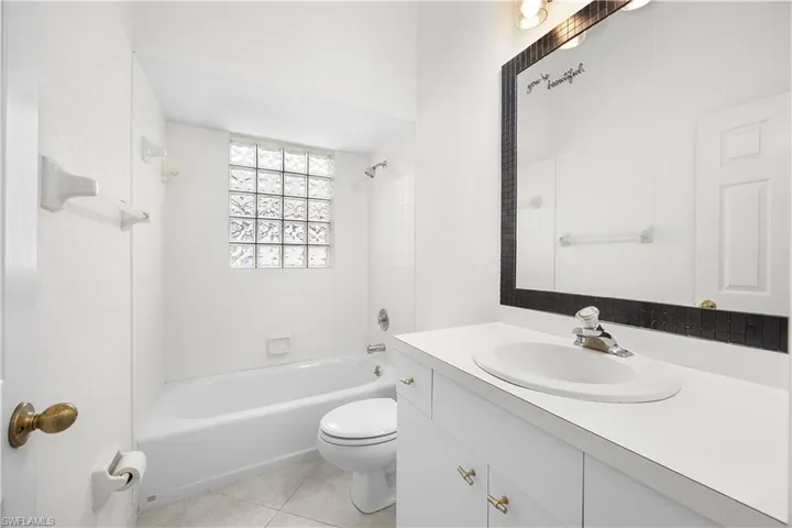 Full bathroom featuring vanity, bathing tub / shower combination, and light tile patterned floors