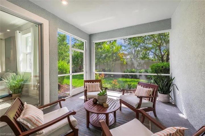 Sunroom featuring a textured wall