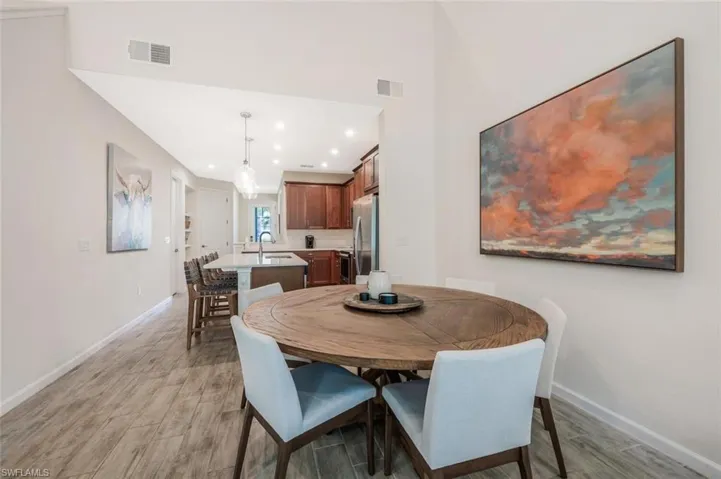 Dining space featuring light wood-type flooring and recessed lighting