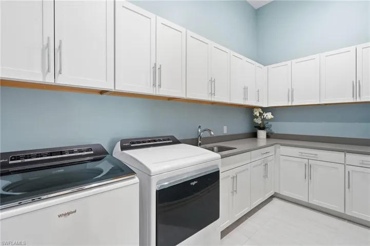 White shaker-style cabinetry with brushed nickel hardware