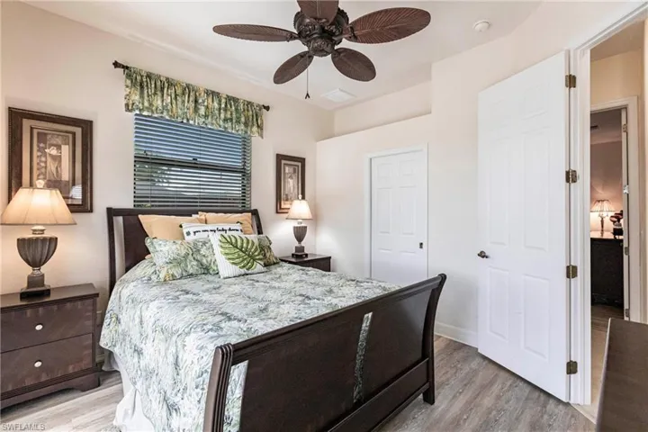 Bedroom with ceiling fan and light hardwood / wood-style flooring