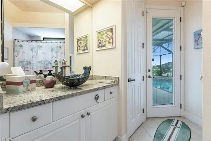 Bathroom with tile flooring and vanity