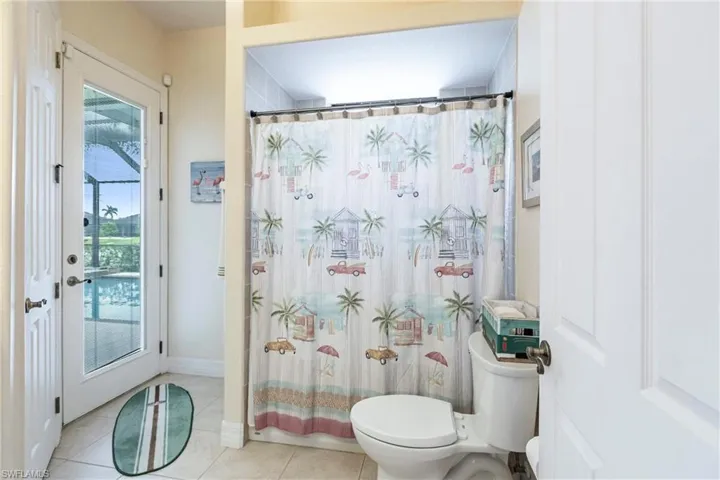 Bathroom featuring tile flooring and toilet