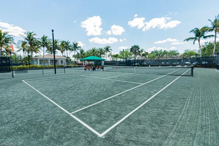 View of tennis court with community basketball court