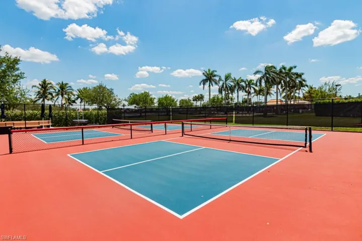 View of tennis court with community basketball court