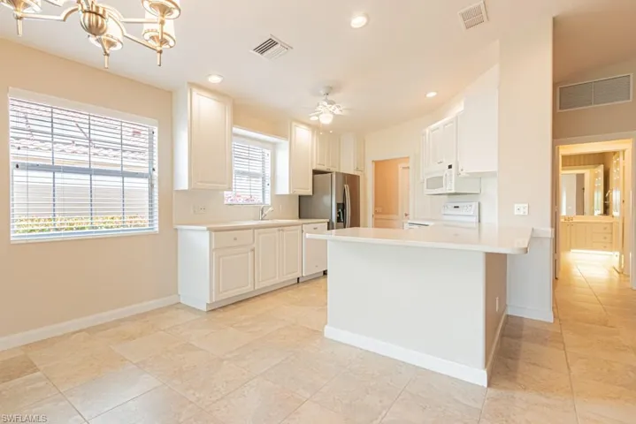 Kitchen featuring new lighting, open