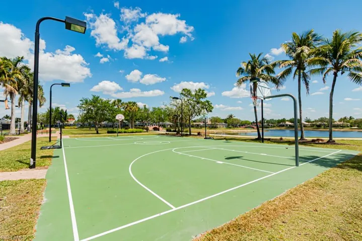 Basketball court with community basketball court and a yard
