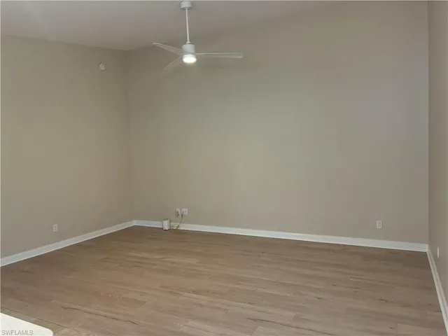 Great Room with cathedral ceiling & new flooring