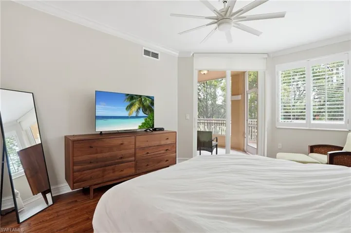 This room features hardwood floors and crown molding